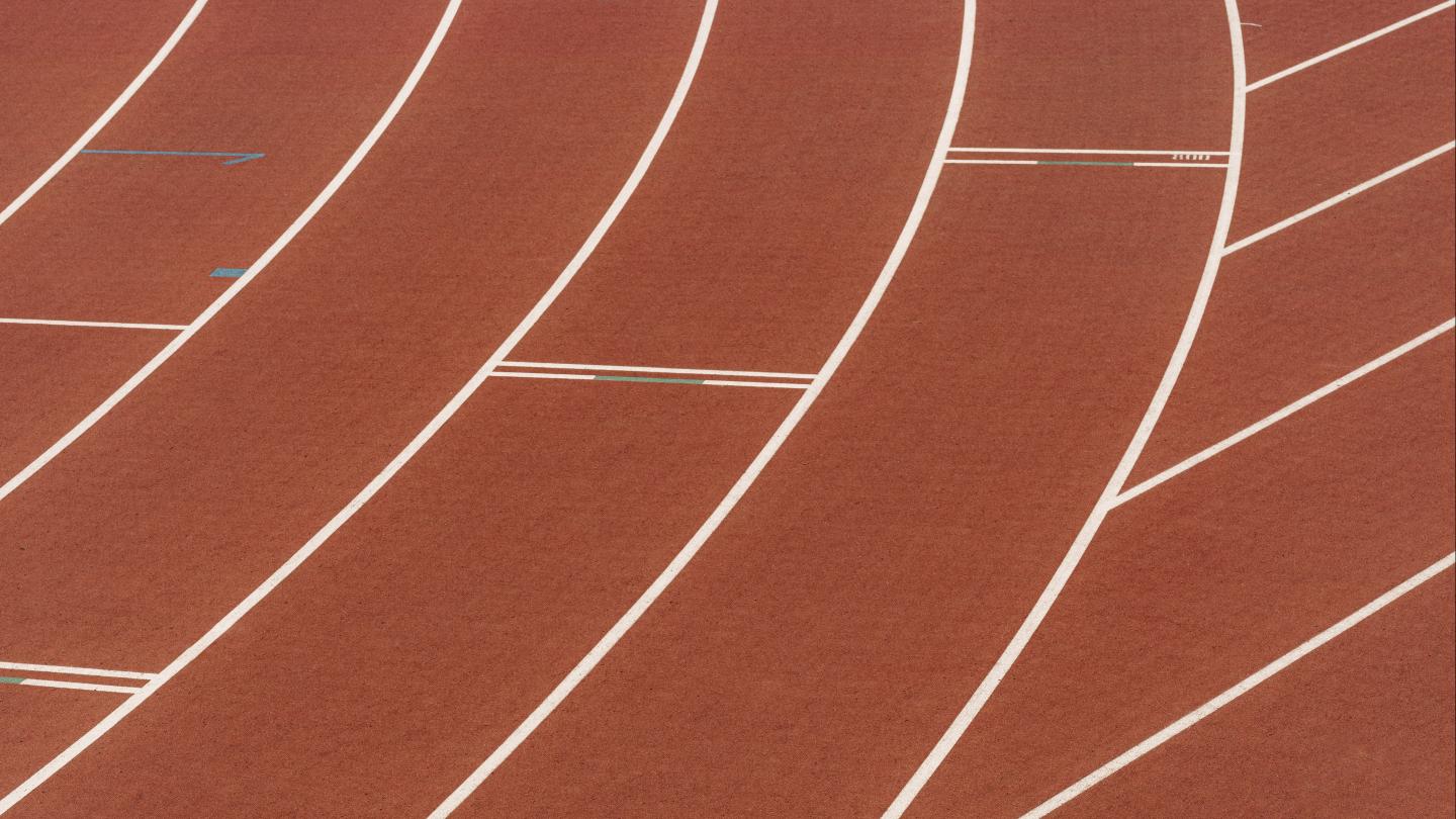 Brown running tracks with white lines