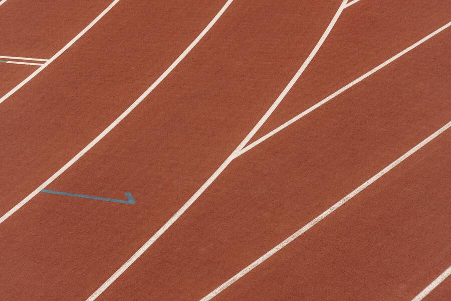 Brown running tracks with white lines