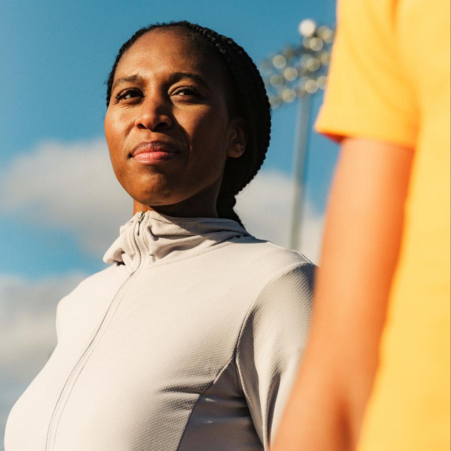Runner is looking at a competitor, with confidence.