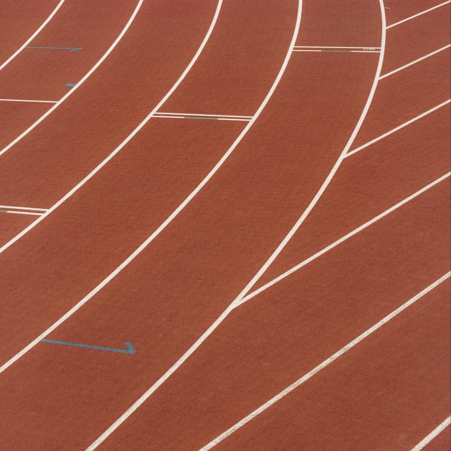 Brown running tracks with white lines