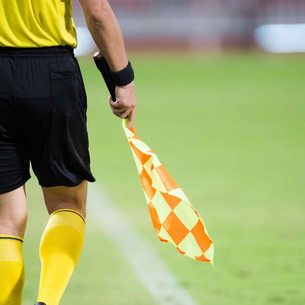 Image of a referee holding a flag