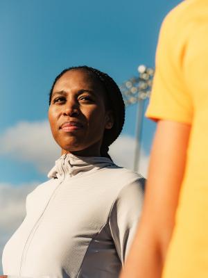 Runner is looking at a competitor, with confidence.
